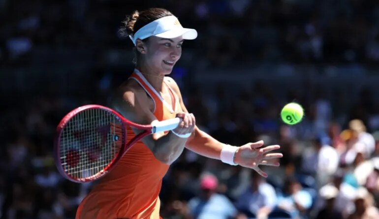USA's Iva Jovic hits a return to Kazakhstan's Yulia Putintseva during their women's singles match on day eight of the Australian Open tennis tournament in Melbourne on January 25, 2026. (Photo by Martin KEEP / AFP) / -- IMAGE RESTRICTED TO EDITORIAL USE - STRICTLY NO COMMERCIAL USE --