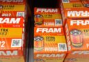 Boxes of Fram Extra Guard oil filters on a store shelf