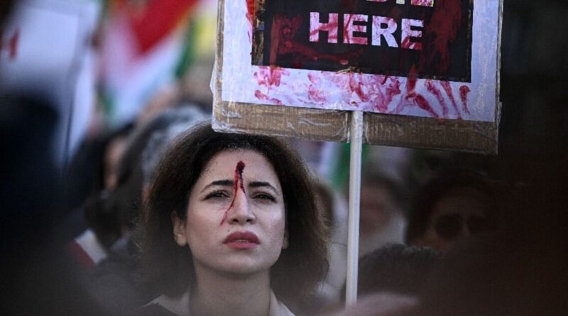 Thousands march in France to back Iranian protesters