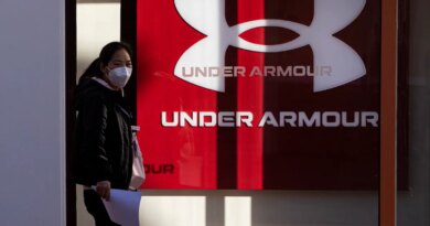 BEIJING, CHINA - JANUARY 09: A pedestrian walks past an Under Armour store on January 9, 2023 in Beijing, China. (Photo by VCG/VCG via Getty Images)