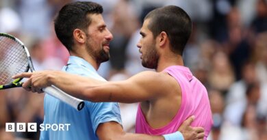 Novak Djokovic and Carlos Alcaraz embrace after their 2025 US Open quarter-final