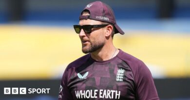 Brendon McCullum looks on during training