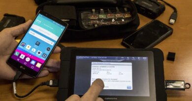 An engineer shows devices and explains the technology developed by the Israeli firm Cellebrite's technology on November 9, 2016 in the Israeli city of Petah Tikva.