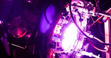 A fusion reactor glows purple.
