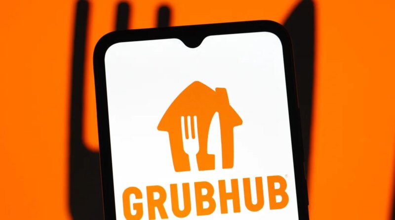 In this photo illustration, the GrubHub logo is seen displayed on a smartphone screen.