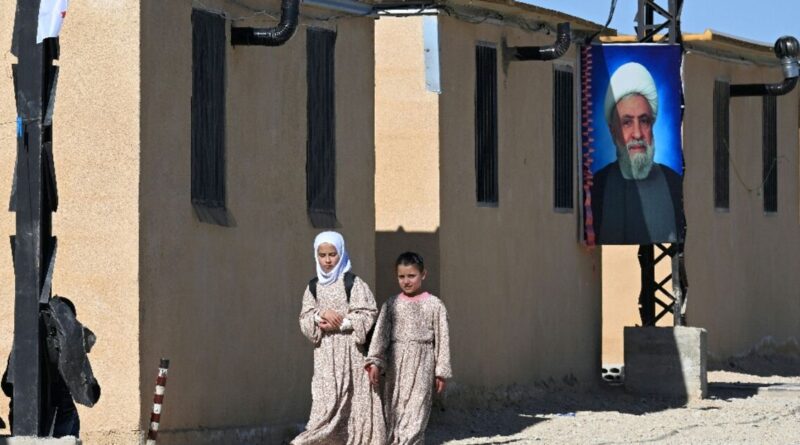 In Lebanon, a Hezbollah-run camp houses people escaping Syria