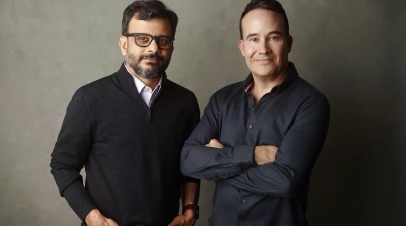 a picture showing the co-founders of Kana, Tom Chavez and Vivek Vaidya, leaning against a grey background