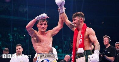 Josh Warrington holds up Leigh Wood's hand