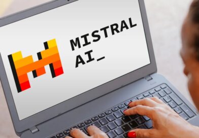 The Mistral AI logo is seen displayed on a laptop screen.