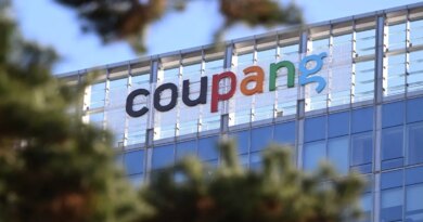 A general view shows the logo of South Korean online delivery service Coupang, at a building housing the headquarters of Coupang in Seoul on December 9, 2025. South Korean police raided the Seoul headquarters of e-commerce giant Coupang on December 9, over a recent data leak believed to have affected almost two-thirds of the country's population.