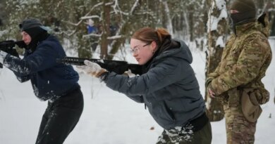 Participants of the a tactical and medical courses run by the 3rd Assault Brigade demonstrate their skills in a final exam for civilians in Kyiv regional center for preparing the population for national resistance, Ukraine, Sunday, Feb. 8, 2026. (AP Photo/Sergei Grits)