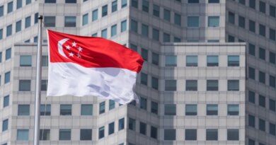 The Singapore flag on top of the parliament building ahead of incoming Prime Minister Lawrence Wong's swearing-in ceremony in Singapore, on Wednesday, May 15, 2024. Wong, Singapore's fourth prime minister since independence, will have to tackle rising cost-of-living concerns, balance US-China tensions and plan for an election after succeeding Lee Hsien Loong. Photographer: Nicky Loh/Bloomberg via Getty Images