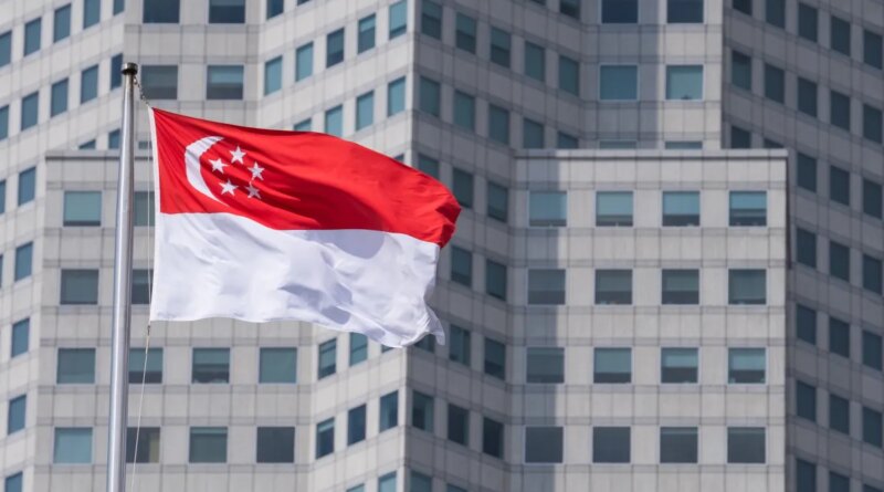 The Singapore flag on top of the parliament building ahead of incoming Prime Minister Lawrence Wong's swearing-in ceremony in Singapore, on Wednesday, May 15, 2024. Wong, Singapore's fourth prime minister since independence, will have to tackle rising cost-of-living concerns, balance US-China tensions and plan for an election after succeeding Lee Hsien Loong. Photographer: Nicky Loh/Bloomberg via Getty Images