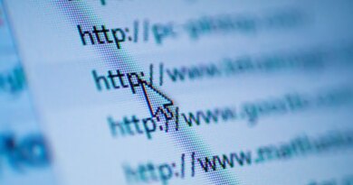 Cursor arrow pointing at URL on screen