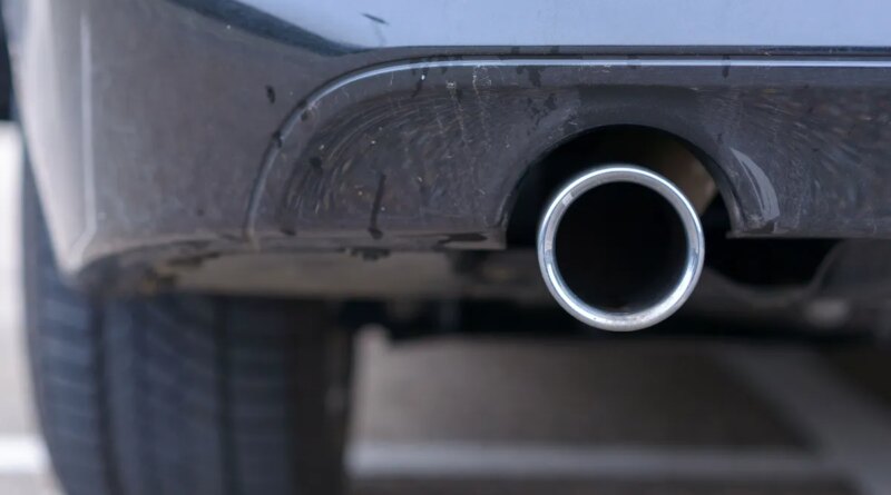 Low angle view of an exhaust pipe on a car.