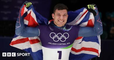 Matt Weston and Martins Dukurs hug