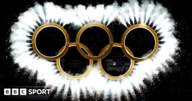 The Olympic rings come together as a fireworks display during the 2026 Winter Olympics opening ceremony in Milan-Cortina