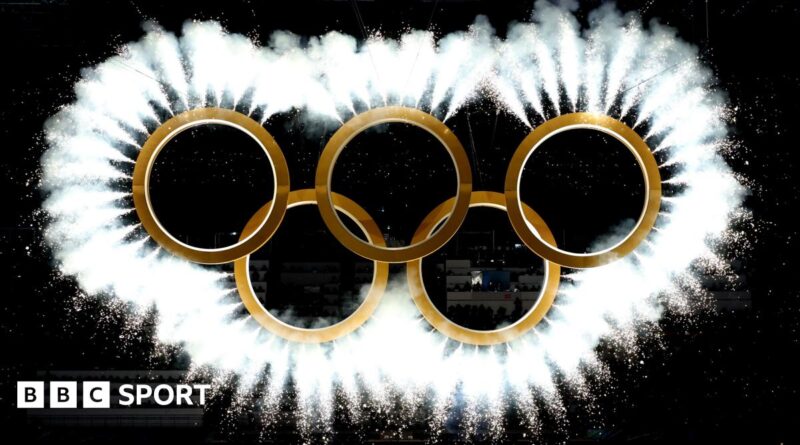 The Olympic rings come together as a fireworks display during the 2026 Winter Olympics opening ceremony in Milan-Cortina