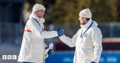 Sturla Holm Laegreid and Johan-Olav Botn shake hands on the podium