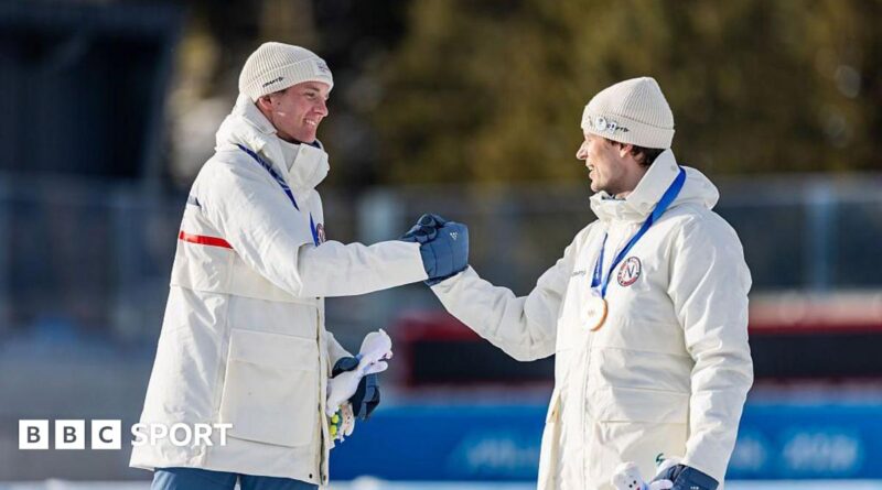 Sturla Holm Laegreid and Johan-Olav Botn shake hands on the podium