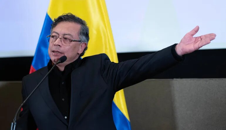 Gustavo Petro speaks at a podium