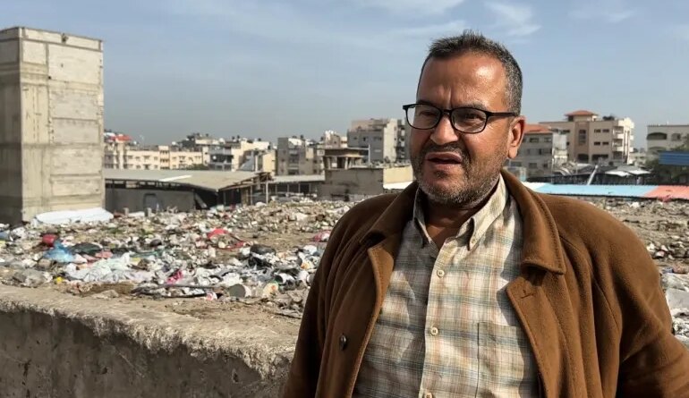 Fayez al-Jadi, a Palestinian father displaced 12 times by the war, says rats run over his children's faces while they sleep in their tent atop a solid waste dump in Gaza City. [Screengrab/Al Jazeera]