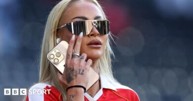 Alisha Lehmann in sunglasses and a red shirt