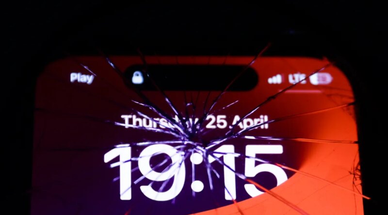 iPhone screen is seen through the broken glass in this illustration photo taken in Krakow, Poland on April 25, 2024.