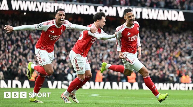 Arsenal players celebrate their goal