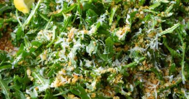 Arugula salad with Parmesan and panko in a wooden bowl.