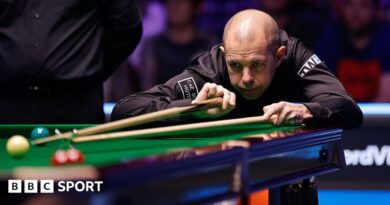 Barry Hawkins in action at the Welsh Open, lining up a shot