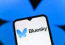 Bluesky logo appears on the screen of a smartphone