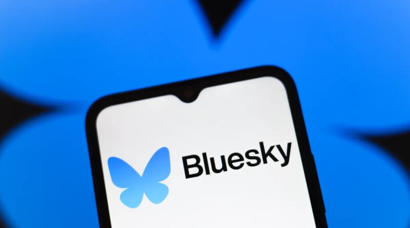 Bluesky logo appears on the screen of a smartphone
