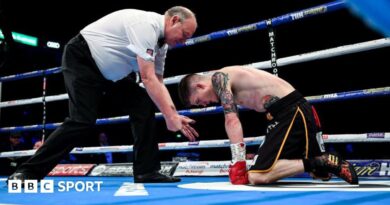 Phil Edwards counts a knocked down Lee Clayton during a boxing match