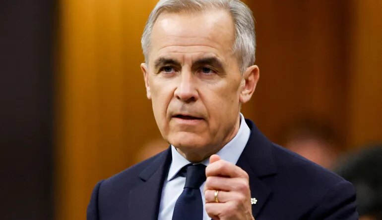 FILE PHOTO: Canada's Prime Minister Mark Carney speaks during Question Period in the House of Commons on Parliament Hill in Ottawa, Ontario, Canada, March 25, 2026. REUTERS/Patrick Doyle/File Photo