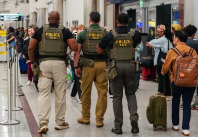 Immigration and Customs Enforcement (ICE) agents as travelers wait in line to be screened at a Transportation Security Administration (TSA) checkpoint at Hartsfield-Jackson Atlanta International Airport (ATL) in Atlanta, Georgia, US, on Monday, March 23, 2026.