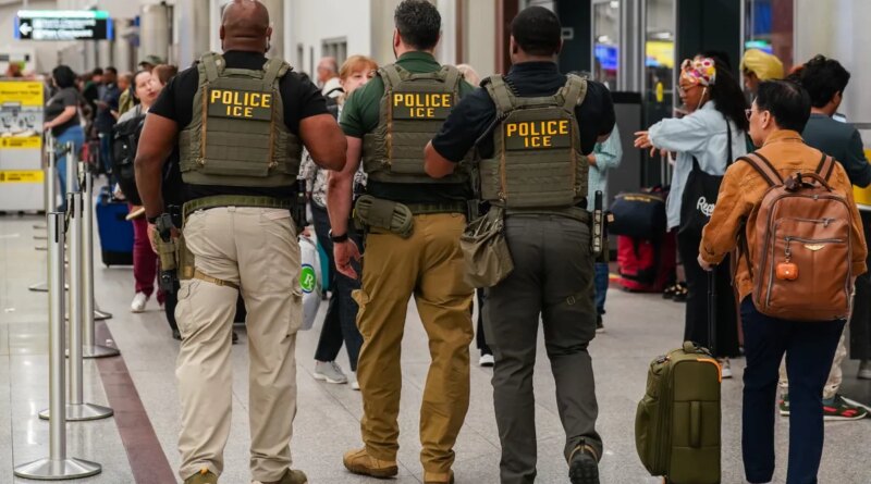 Immigration and Customs Enforcement (ICE) agents as travelers wait in line to be screened at a Transportation Security Administration (TSA) checkpoint at Hartsfield-Jackson Atlanta International Airport (ATL) in Atlanta, Georgia, US, on Monday, March 23, 2026.