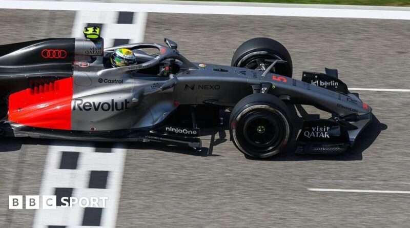 Lewis Hamilton drives the new Ferrari on track in Bahrain, with a McLaren in the background