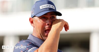 American golfer Gary Woodland wipes away a tear after winning the Houston Open