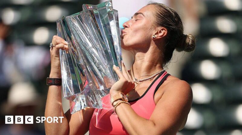 Aryna Sabalenka kisses the Indian Wells trophy