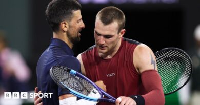 Novak Djokovic and Jack Draper hug at the net after their match at Indian Wells