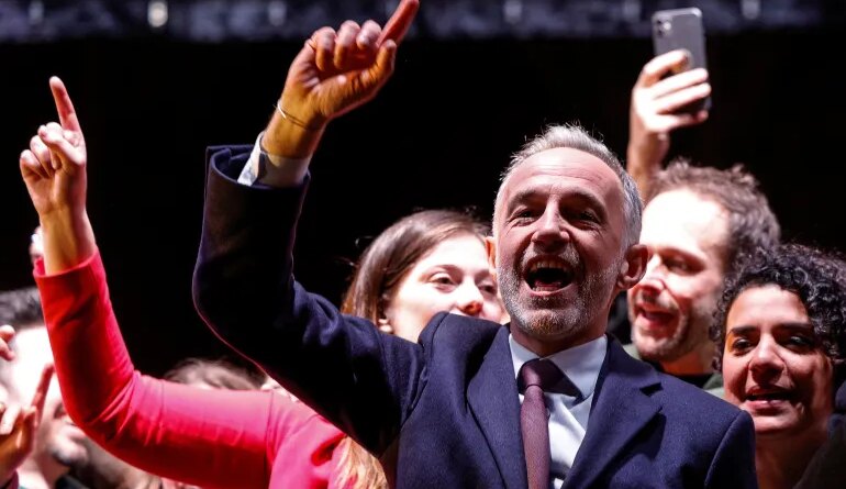 Socialist Party (PS) Member of Parliament and left wing Paris mayoral candidate Emmanuel Gregoire celebrates during a gathering following the second round of France's 2026 municipal elections in Paris on March 22, 2026.