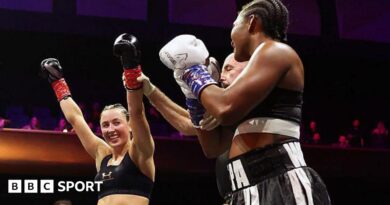 Jade Jones' arm is lifted as the winner of the boxing bout against Egypt Criss