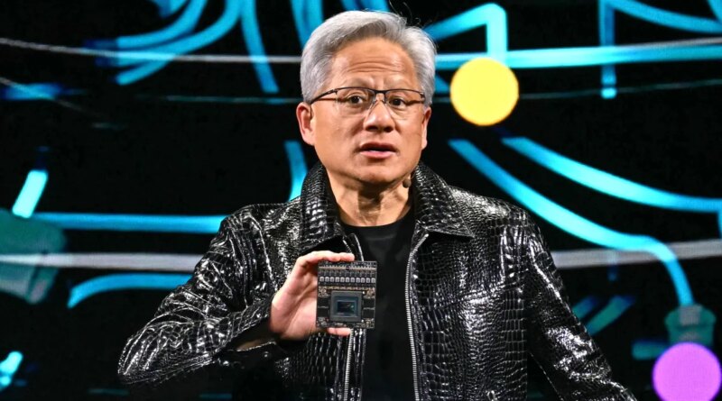 Jensen Huang holds up chip at CES 2025