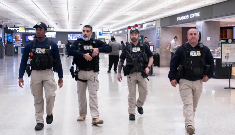 Armed federal agents at an airport
