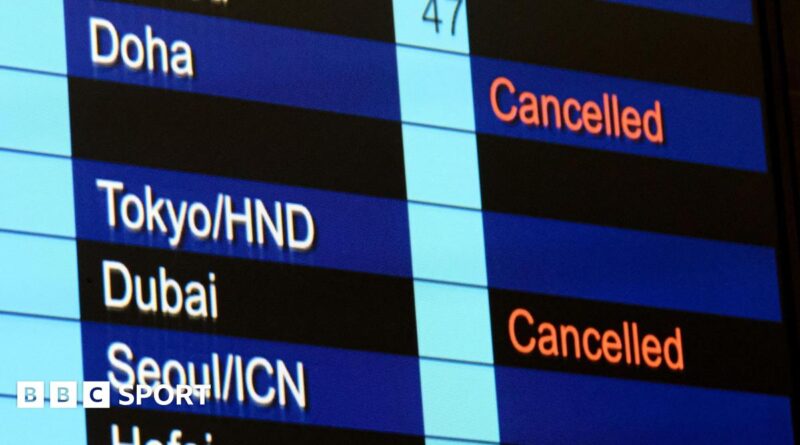 Cancelled flights to Dubai and Doha shown on flight information display at Hong Kong International Airport