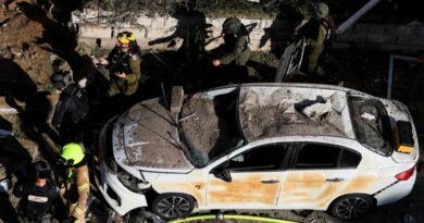 This picture shows damaged buildings at the site of an Iranian missile strike in Tel Aviv