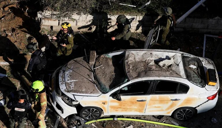 This picture shows damaged buildings at the site of an Iranian missile strike in Tel Aviv