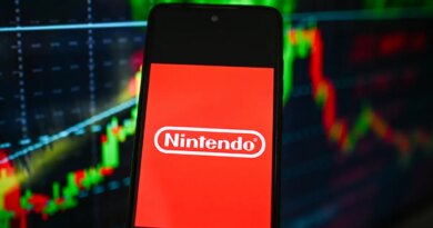 Nintendo logo is seen displayed on a smartphone with stock market percentages on the background.