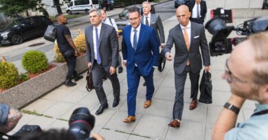 Trevor Milton, founder of Nikola Corp., center, exits court in New York, US